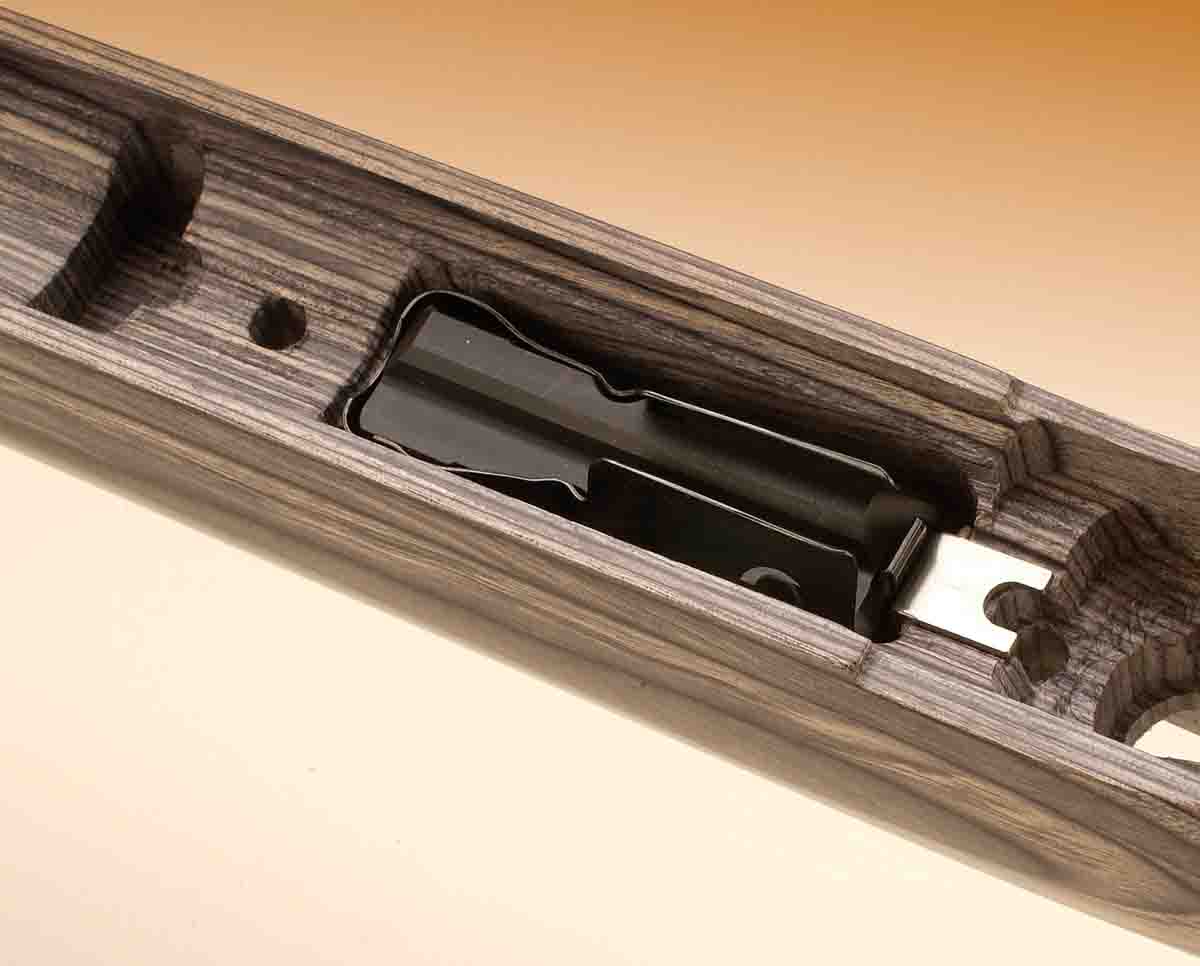 The magazine is held in place by stock inletting.